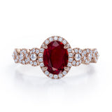 Twisted 1.45 Carat Oval Cut Lab Ruby And Diamond Halo Engagement Ring In White Gold