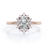Floating Halo 0.6 carat Oval Moissanite and Diamond Engagement Ring in Rose Gold