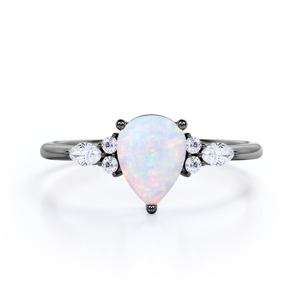 Affordable 1.35 Carat Tear Drop White Opal And Diamond  Seven Stone Engagement Ring In White Gold.