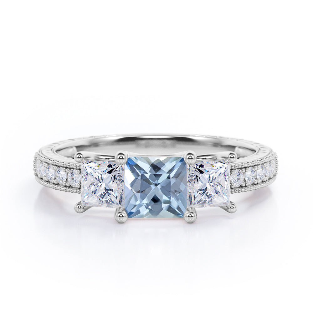 Trilogy 1.25 Carat Princess Cut Aquamarine And Diamond Three Stone Vintage Milgrain Engagement Ring In Rose Gold