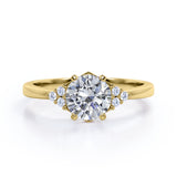 Tapered Classic 0.55 carat Round Moissanite and Diamond Engagement Ring in White Gold