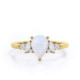 Seven Stone 0.6 Ct Pear Cut Lab Created Opal Engagement Ring