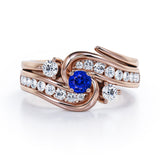 Twisted Tension - Prong 1 TCW Round Brilliant Cut Blue Sapphire and Moissanite - Flush Channel Wedding Set in White Gold