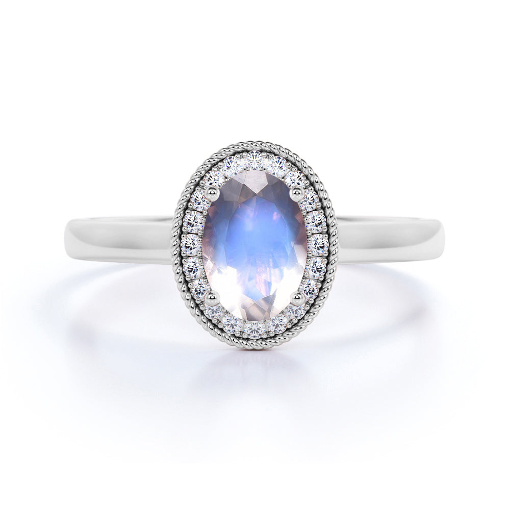 Massive 1.25 Carat Oval Dark Blue Moonstone and Diamond Halo Engagement Ring in Rose Gold