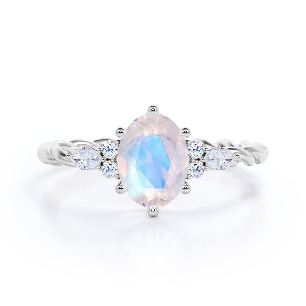 7 Stone 0.55 carat Oval Moonstone and Moissanite Twisted Rope Shank Engagement Ring in Rose Gold