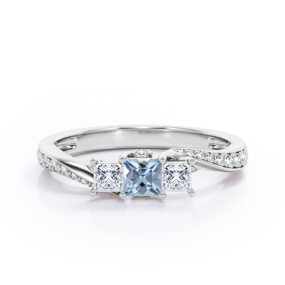 Scale Bridge Accent 0.65 carat Princess Aquamarine and Moissanite Twisted Wave Engagement Ring in Rose Gold