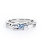 Scale Bridge Accent 0.65 carat Princess Aquamarine and Moissanite Twisted Wave Engagement Ring in Rose Gold