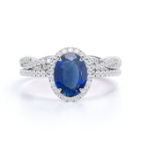 Antique Design 2.25 Carat Oval Cut Sapphire and Diamond Halo Wedding Set with Infinity Band in White Gold