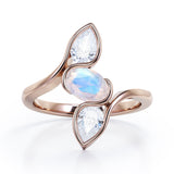 Distorted Line Three Stone 1 carat Oval and Pear Moonstone and moissanite Ring in Rose Gold