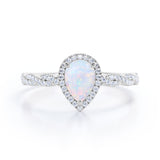 Twisted 1.45 Ct Pear Cut Lab Created Opal Engagement Ring