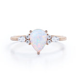 Affordable 1.35 Carat Tear Drop White Opal And Diamond  Seven Stone Engagement Ring In White Gold.
