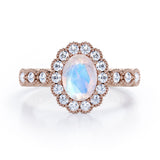 Vintage Floral Halo 0.7 carat Oval and Round Moonstone and diamond Engagement Ring in Rose Gold