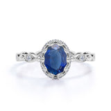 Vintage Art Deco 1.15 Carat Oval cut Blue Lab-Created Sapphire and Diamond Bezel Engagement Ring
