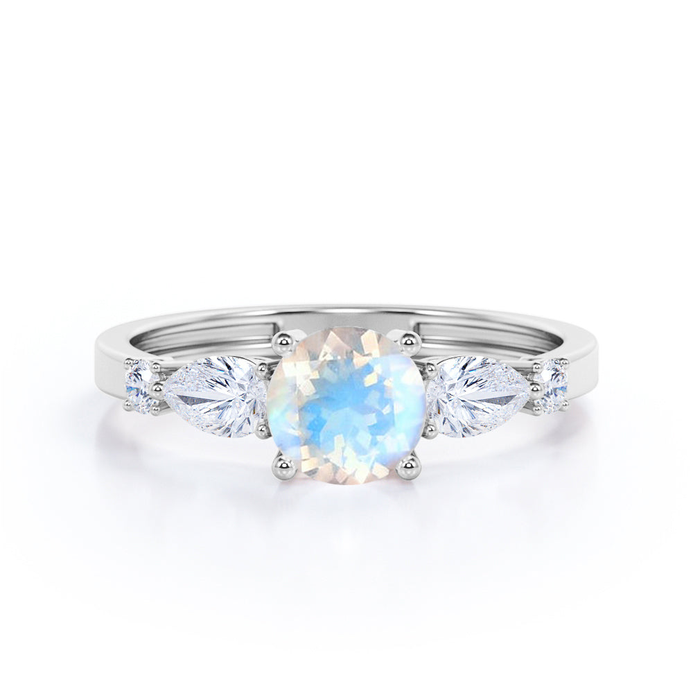 Five Stone Connection 0.6 carat Round Moonstone and Moissanite Engagement Ring in Rose Gold