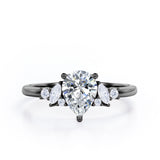 Fashionable 7 Stones 0.6 carat Pear Moissanite and Diamond Engagement Ring in Rose Gold