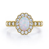 Vintage Floral Halo 0.7 carat Oval and Round Opal and diamond Engagement Ring in Rose Gold