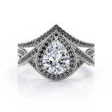 Milgrain Halo-Style 1.75 TCW Pear Cut Moissanite with Lab Created Black Diamond Pave Channel Wedding Ring Set in Black Gold