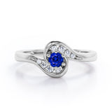 Whirly Gemstone 0.55 carat Round Blue Sapphire and Moissanites Artistic Engagement Ring in White Gold