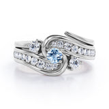 Twisted Tension - Prong 1 TCW Round Brilliant Cut Aquamarine and Moissanite - Flush Channel Wedding Set in White Gold