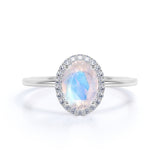 Antique 1.25 Carat Oval Cabochon Cut Blue Moonstone and Diamond Halo Engagement Ring in White Gold