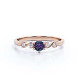 Classic Six Prong 1.10 Carat Round Cut Lab Created Alexandrite And Diamond Five Stone Engagement Ring In White Gold.