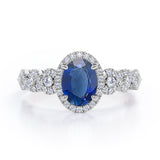 Twisted 1.45 Carat Oval Cut Sapphire And Diamond Halo Engagement Ring In White Gold