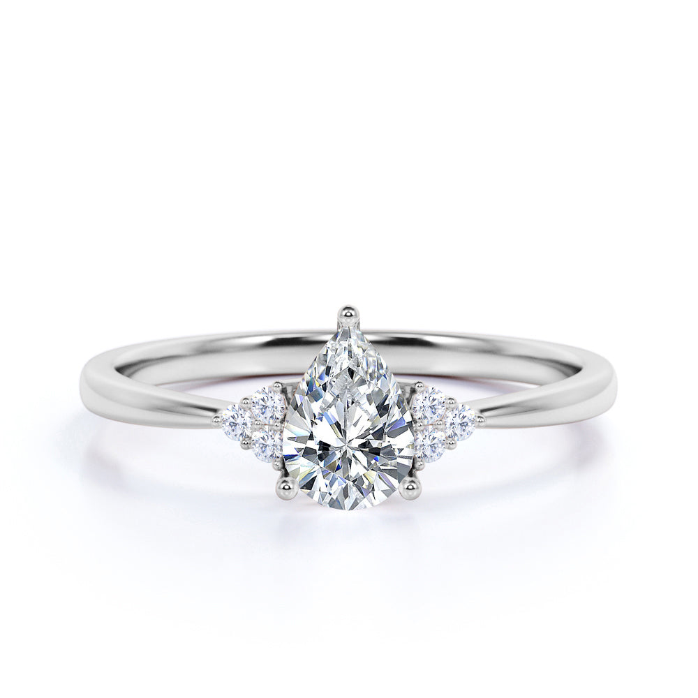 7 Stone Design 1.15 Carat Teardrop Moissanite and Tapered Shank Diamond Engagement Ring in Rose Gold