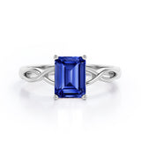 Solitaire 1 Carat Lab-Created Emerald Cut Sapphire Infinity Engagement Ring In White Gold