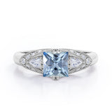 Vintage Eight Prongs 1.30 Carat Princess Cut Aquamarine And Diamond Marquise Framed Beaded Engagement Ring In White Gold