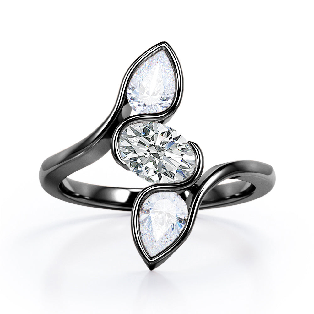 Distorted Line Three Stone 1 carat Oval and Pear Moissanite Ring in Rose Gold