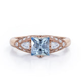 Vintage Eight Prongs 1.30 Carat Princess Cut Aquamarine And Diamond Marquise Framed Beaded Engagement Ring In White Gold