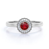Plain Shank 1.25 Carat Round Cut Ruby and Diamond Bezel Halo Engagement Ring in White Gold