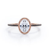 Milgrain Bezel Prong 1.5 TCW Oval Cut Moissanite with Lab Created Black Diamond Pave Style Engagement Ring in Rose Gold