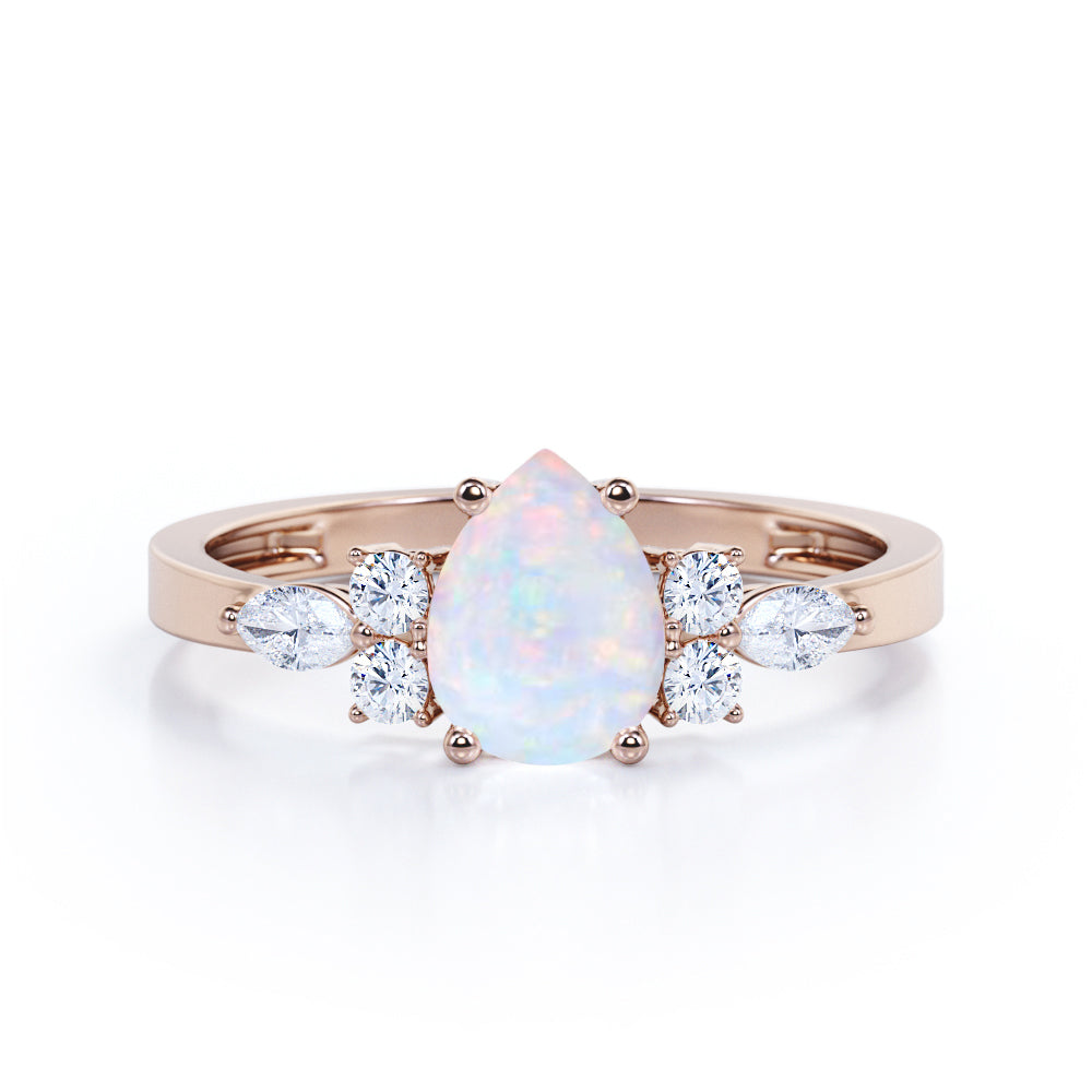 Four Prong Basket Set 1.35 Carat Pear Cut Ethiopian Opal And Diamond Seven Stone Engagement Ring In White Gold