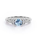 Unique Four Prong 1.15 Carat Round Cut Aquamarine And Diamond Art Deco Engagement Ring In White Gold