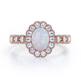Vintage Floral Halo 0.7 carat Oval and Round Opal and diamond Engagement Ring in Rose Gold