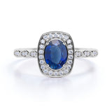 1.50 Carat Oval cut Sapphire and Diamond Vintage Halo Art Deco Engagement Ring in White Gold