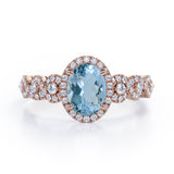 Twisted 1.45 Carat Oval Cut Aquamarine And Diamond Halo Engagement Ring In White Gold