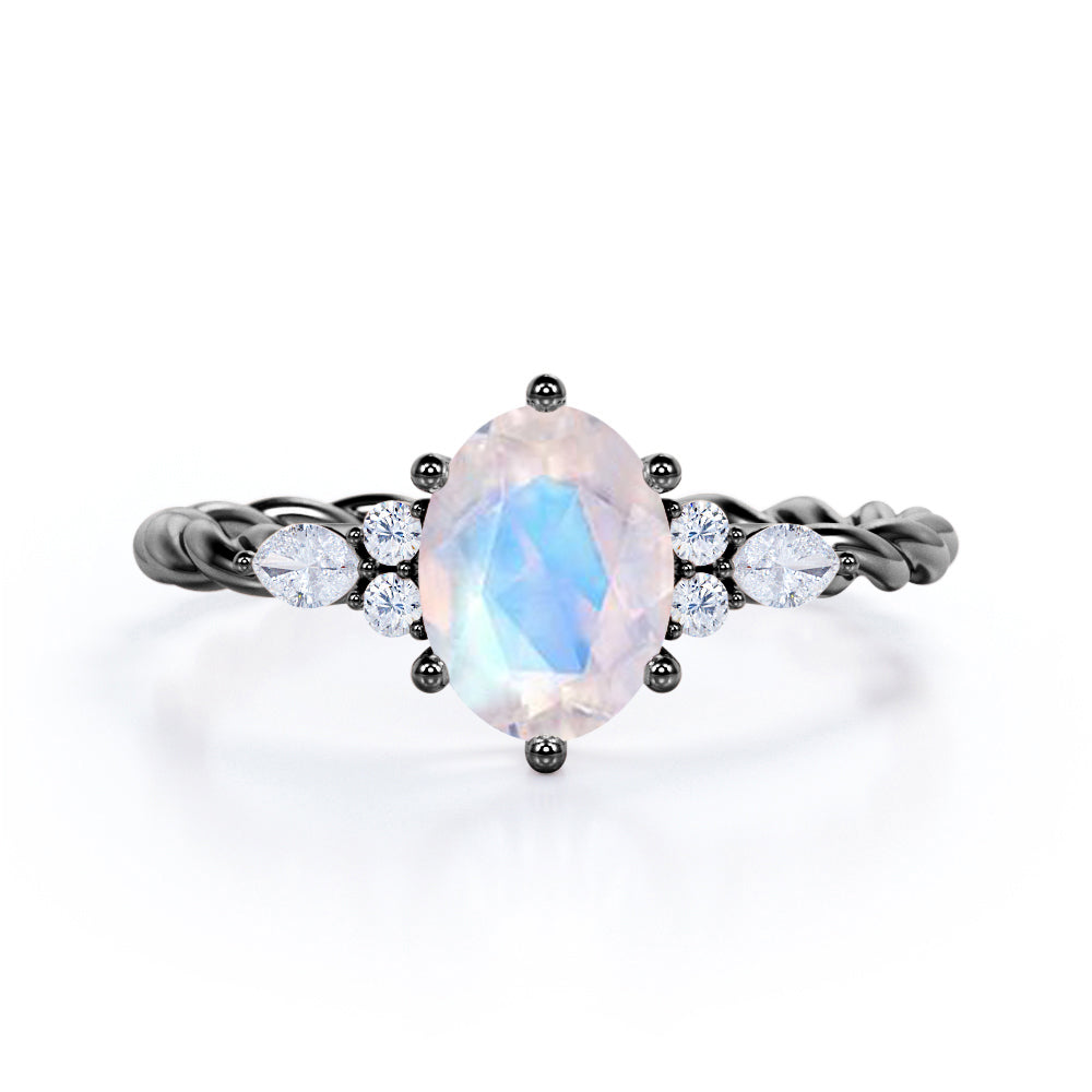 7 Stone 0.55 carat Oval Moonstone and Moissanite Twisted Rope Shank Engagement Ring in Rose Gold