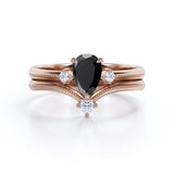 1 carat tear drop cut Black Diamond V shaped wedding ring set in white gold