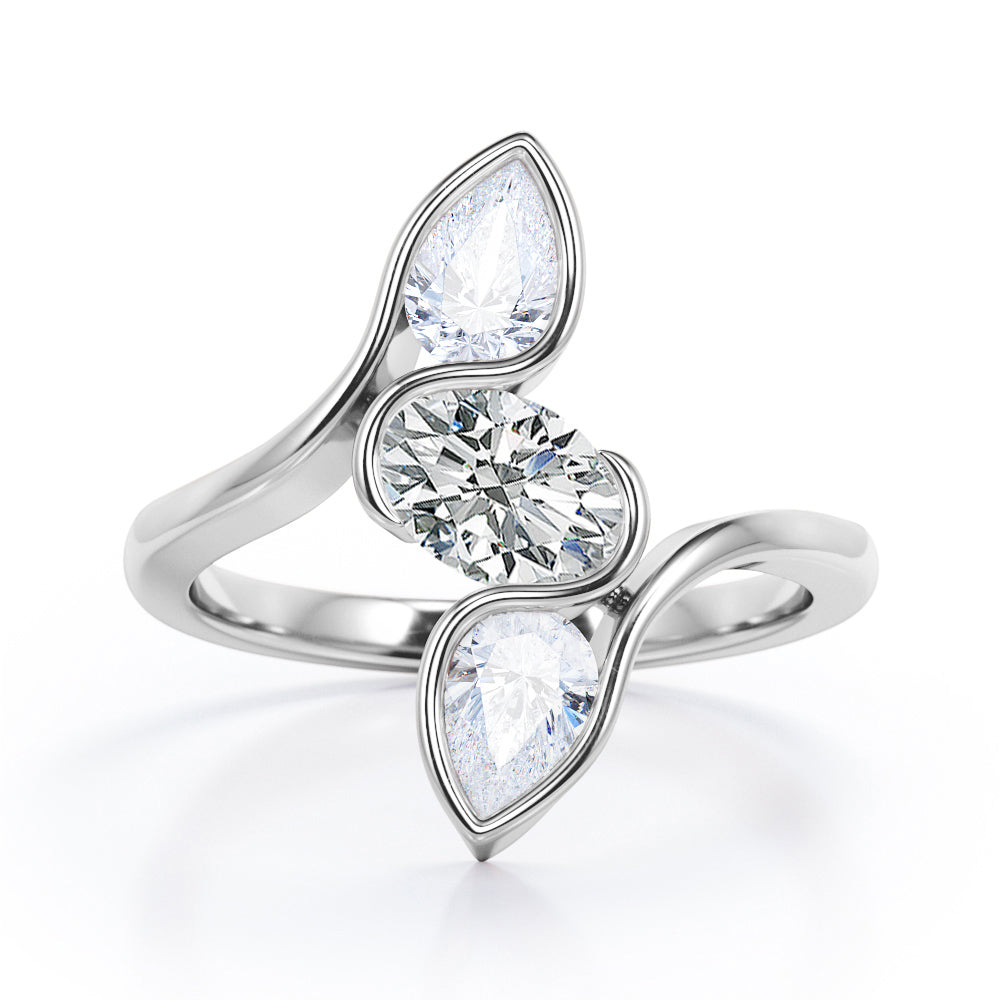 Distorted Line Three Stone 1 carat Oval and Pear Moissanite Ring in Rose Gold