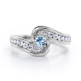 Spinning 0.7 carat Round Aquamarine and Moissanite Channel Engagement Ring in White Gold