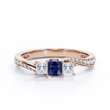 Scale Bridge Accent 0.65 carat Princess Blue Sapphire and Moissanite Twisted Wave Engagement Ring in Rose Gold