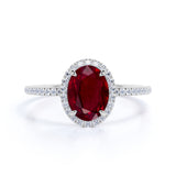 Antique Design 1.50 Carat Oval Cut Lab Ruby and Diamond Halo Engagement Ring in White Gold