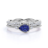 Milgrain Three Stone Bezel Set 2 Carat Pear Cut Sapphire and Diamond Wedding Set with Infinity Band in White Gold