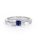Scale Bridge Accent 0.65 carat Princess Blue Sapphire and Moissanite Twisted Wave Engagement Ring in Rose Gold