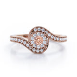 Wrapped Round 0.65 carat Round Morganite and Moissanites Bypass Engagement Ring in Rose Gold