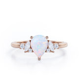 Seven Stone 0.6 Ct Pear Cut Lab Created Opal Engagement Ring
