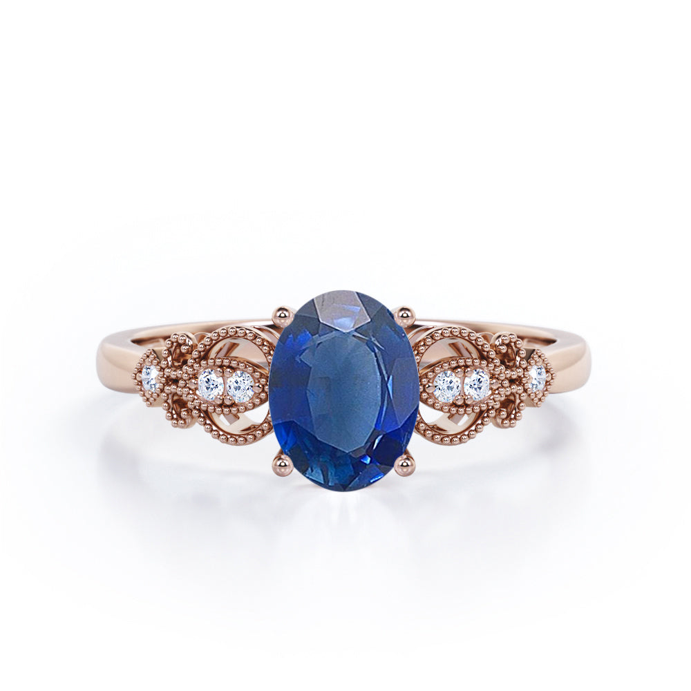 Swirly 0.5 carat Oval Blue Sapphire and Diamonds Antique Engagement Ring in White Gold