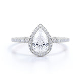 1.50 Carat Pear Cut Moissanite and Diamond Halo Engagement Ring in White Gold